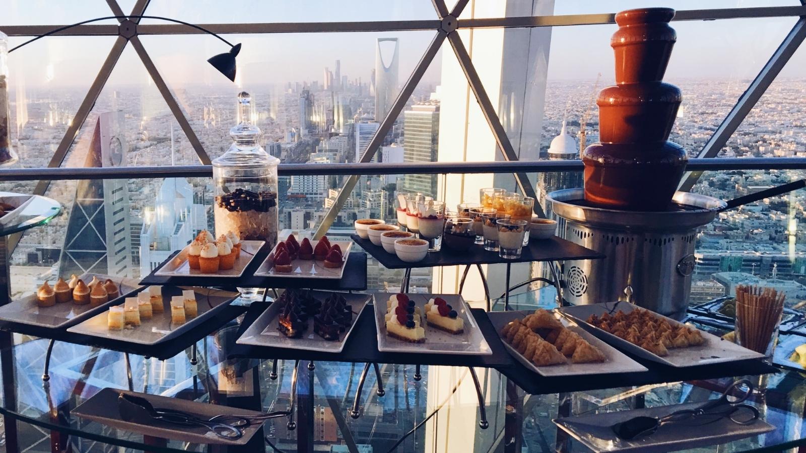 afternoon high tea dessert canape buffet overlooking riyadh city, saudi arabia