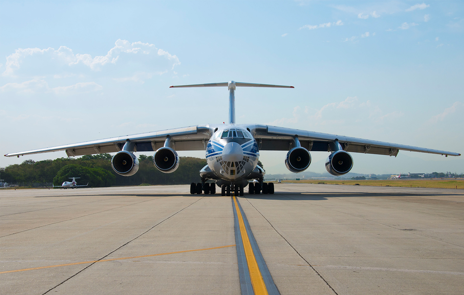 Ilyushin IL76 cargo charter aircraft for freight on airport runway in morning