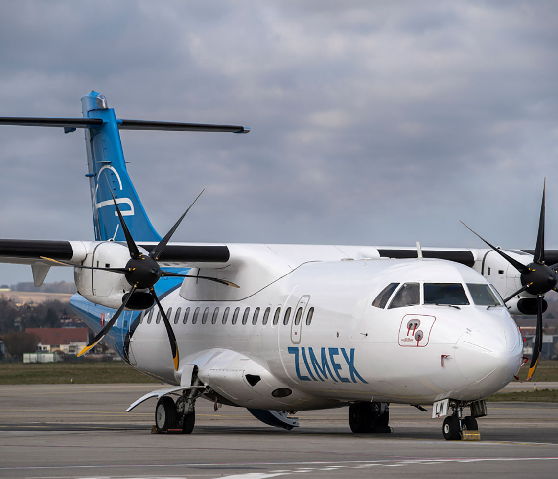 ATR 42 cargo charter plane on runway in day