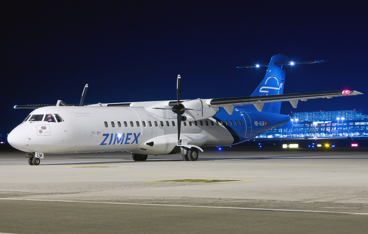 ATR-72 cargo charter plane on airport runway