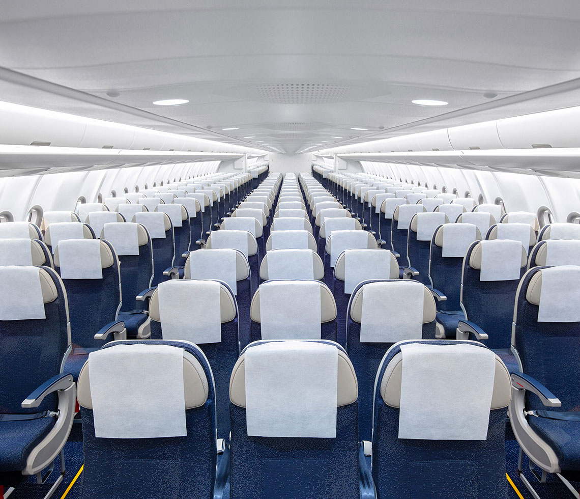 Airbus A330-200 private aircraft interior cabin with headrest covers on blue seats