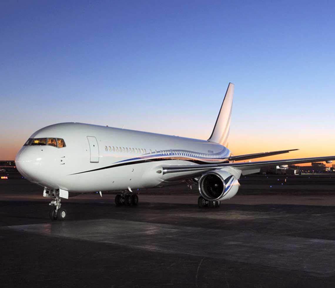 Boeing 767-VIP private aircraft charter on runway at night