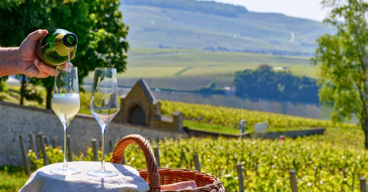 France Champagne region with person serving champagne