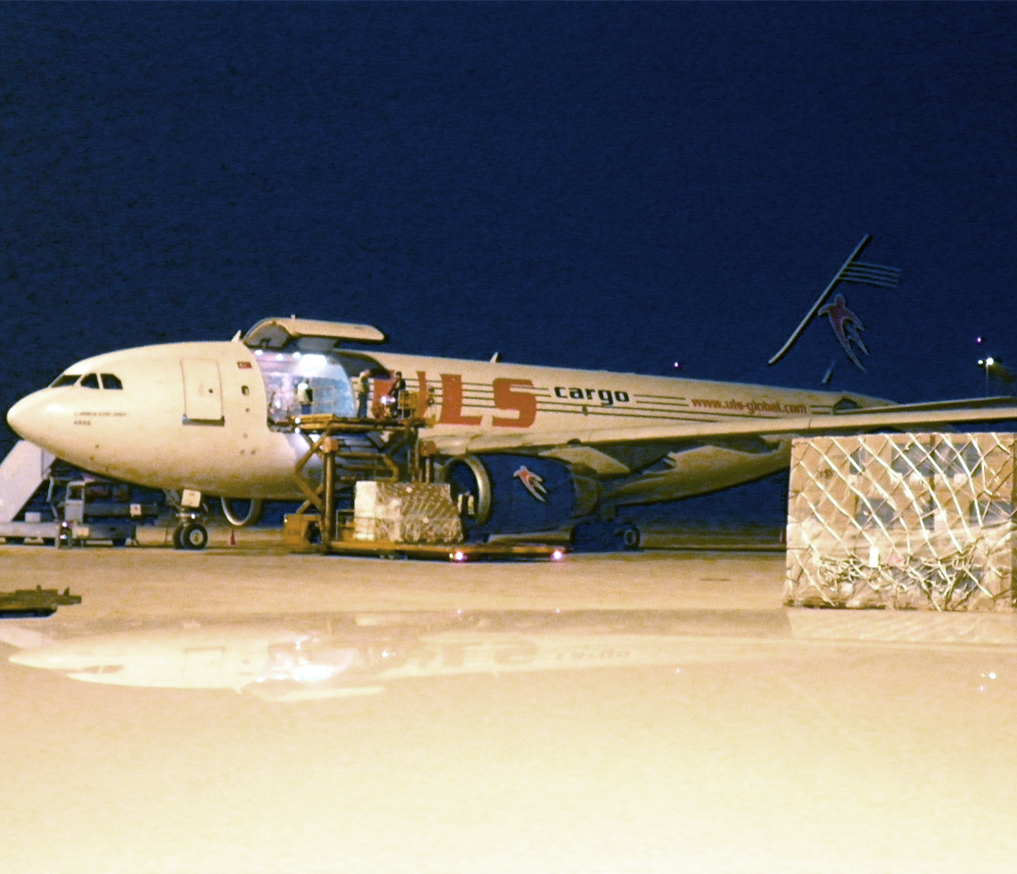 Airbus A310F cargo charter aircraft with freight on runway