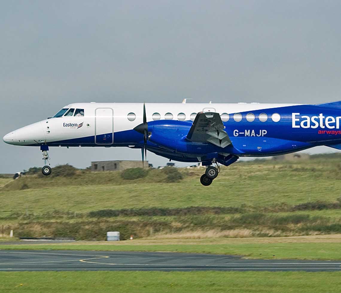 Jetstream-41 chartered private flight landing by grassy hill