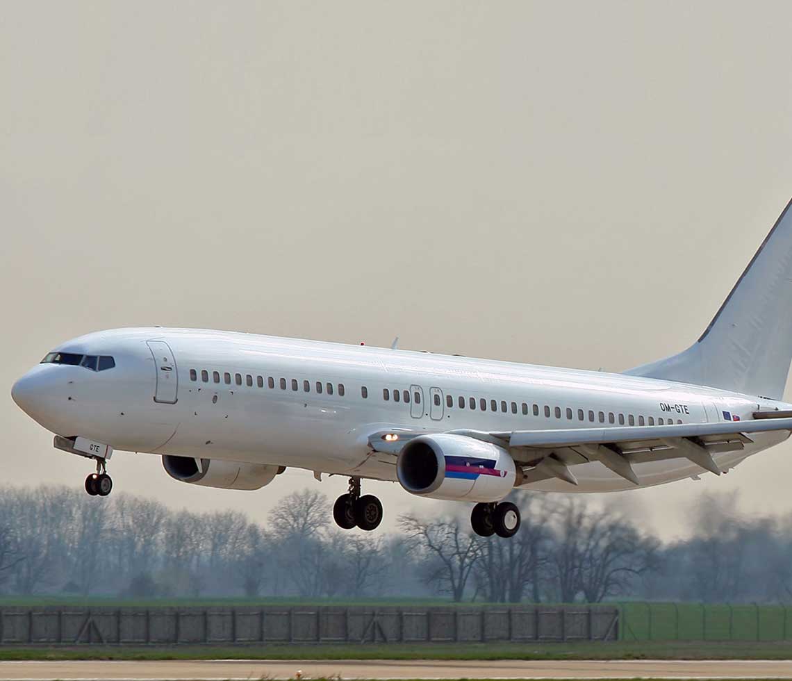 Boeing B737-800 private aircraft charter takeoff from airstrip