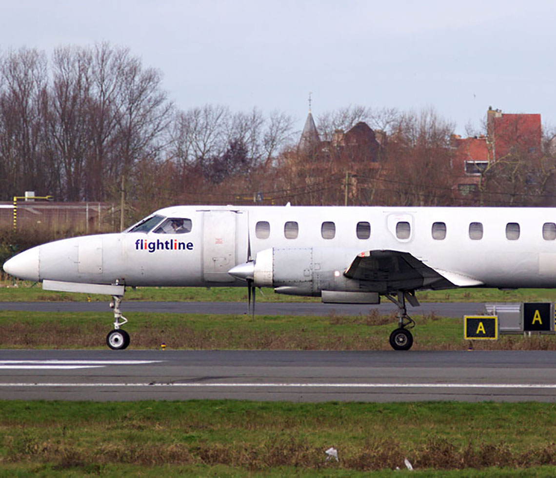 Metro III cargo aircraft charter on airport runway in daytime