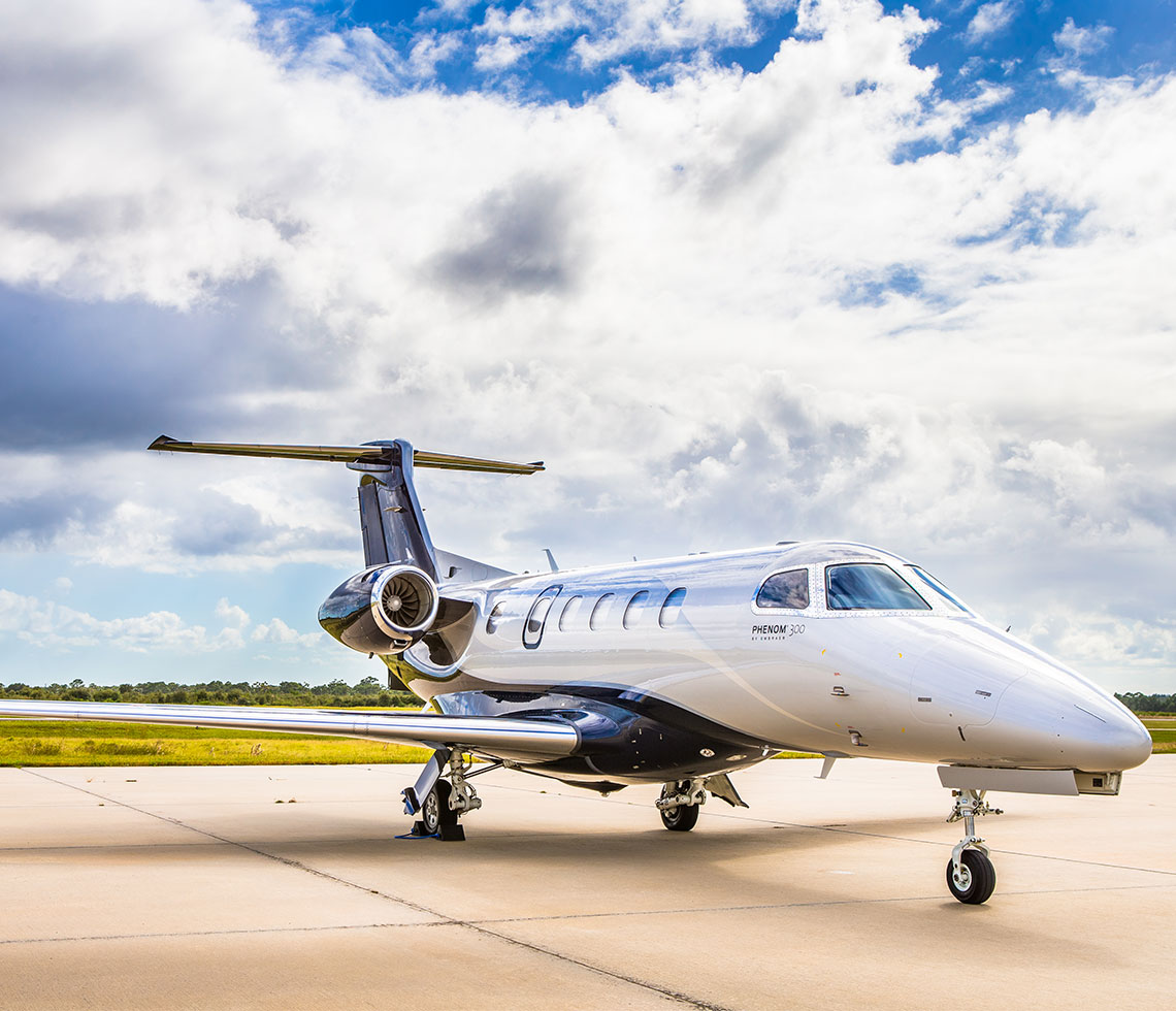 Embraer Phenom 300 private jet on runway