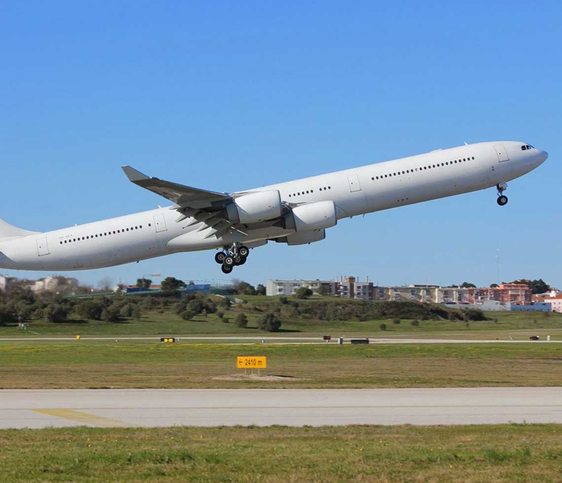 Airbus A340-600 large private aircraft charter flight taking off runway strip